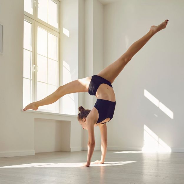 A dancer in a handstand stretch.